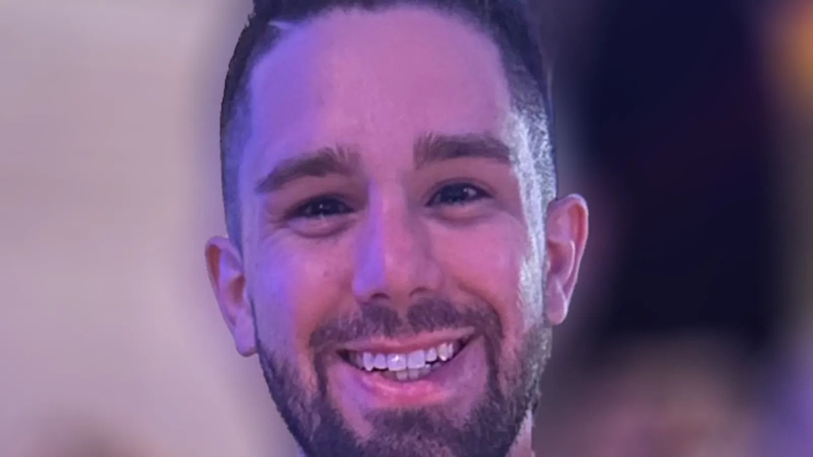 Close up of Daniel Brandenburg smiling with blurred background