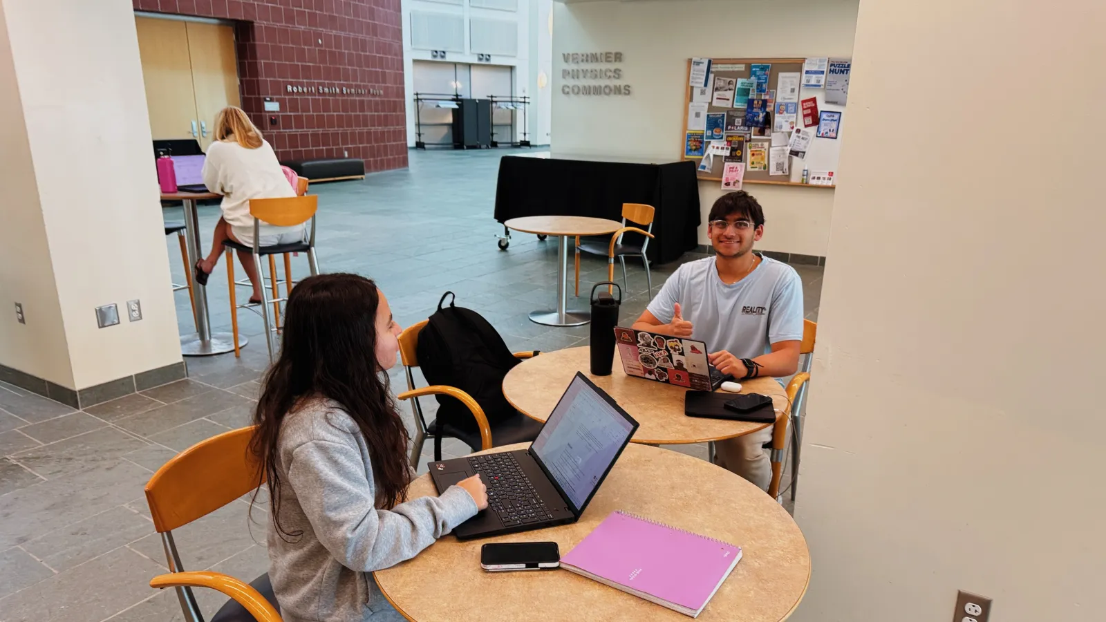 two students at a table working