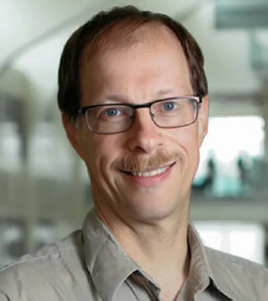 Professional headshot; Ralf Smiling
