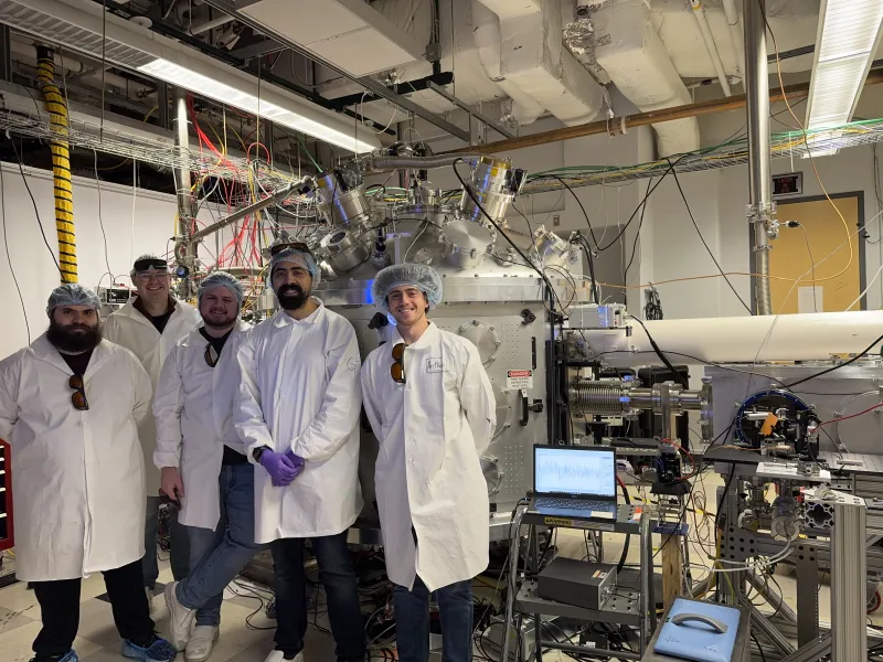 Group. of Physicists smiling