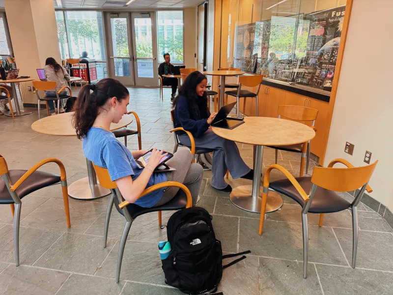 two students at a table working