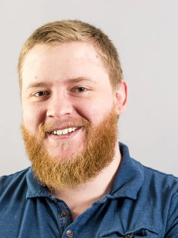 Headshot of Ben Miller, on plain grey background