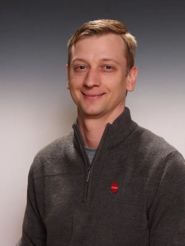 Headshot of Bob Concitis, on plain grey background